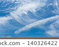 Contrails in the sky during the rainy season; blue sky and clouds. 140326422