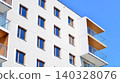 View of modern residential building with glass balconies and bright facade. Contemporary apartment building in european city. Concept of urban living and modern architecture.  140328076