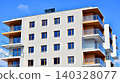 View of modern residential building with glass balconies and bright facade. Contemporary apartment building in european city. Concept of urban living and modern architecture.  140328077