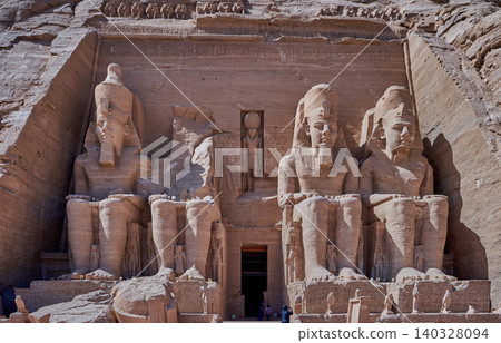 Abu Simbel, Aswan, Egypt- February 10 2025: Abu Simbel Temples in Abu Simbel Aswan, Egypt exterior daylight shot showing The Great Temple of Ramesses II with tourist at the main entrance Abu Simbel, Aswan, Egypt- February 10 2025: Abu Simbel Temples in Abu Simbel Aswan, Egypt exterior daylight shot showing The Great Temple of Ramesses II with tourist at the main entrance 140328094