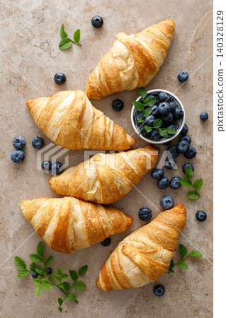 Croissant with blueberries for breakfast Croissant with blueberries for breakfast 140328129