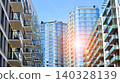 View of modern residential building with glass balconies and bright facade. Contemporary apartment building in european city. Concept of urban living and modern architecture.  140328139