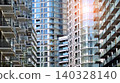 View of modern residential building with glass balconies and bright facade. Contemporary apartment building in european city. Concept of urban living and modern architecture.  140328140