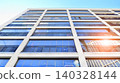 View of modern residential building with glass balconies and bright facade. Contemporary apartment building in european city. Concept of urban living and modern architecture.  140328144