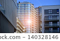 View of modern residential building with glass balconies and bright facade. Contemporary apartment building in european city. Concept of urban living and modern architecture.  140328146