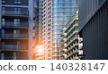 View of modern residential building with glass balconies and bright facade. Contemporary apartment building in european city. Concept of urban living and modern architecture.  140328147
