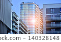View of modern residential building with glass balconies and bright facade. Contemporary apartment building in european city. Concept of urban living and modern architecture.  140328148
