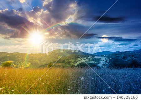 day meet night. mountain landscape with field. sun and moon in harmony over trees on the hills and rural valley beneath an epic sky in the background. view of carpathian mountains on summer solstice day meet night. mountain landscape with field. sun and moon in harmony over trees on the hills and rural valley beneath an epic sky in the background. view of carpathian mountains on summer solstice 140328160