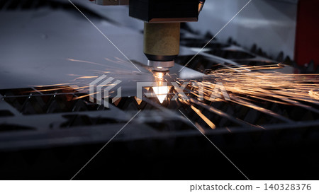 Laser cutting machine. High precision laser cutting robot processing sheet metal in factory. Ai automated CNC manufacturing technology creates intricate components with sparks accuracy and efficiency Laser cutting machine. High precision laser cutting robot processing sheet metal in factory. Ai automated CNC manufacturing technology creates intricate components with sparks accuracy and efficiency 140328376
