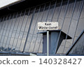 No winter maintenance warning sign in german against reflecting facade No winter maintenance warning sign in german against reflecting facade 140328427