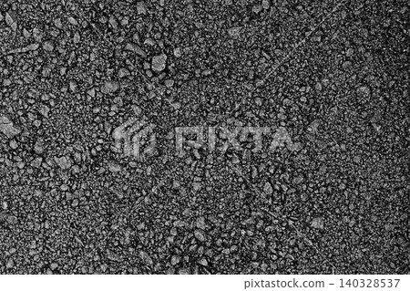 Surface of black freshly laid and rolled asphalt with distinguishable gravel fractions. Blank for artwork, texture materials for games and others Surface of black freshly laid and rolled asphalt with distinguishable gravel fractions. Blank for artwork, texture materials for games and others 140328537