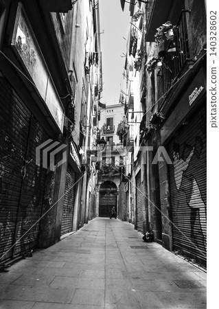 Barcelona gothic quarter empty street with closed shops Barcelona gothic quarter empty street with closed shops 140328602