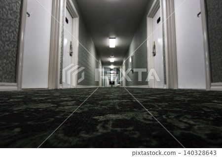 Empty hotel hallway leading into vanishing point distance Empty hotel hallway leading into vanishing point distance 140328643