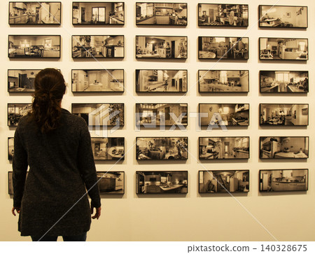 Woman observing kitchen interior grid art exhibition Woman observing kitchen interior grid art exhibition 140328675