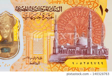 Egyptian Ten pounds EGP polymer banknote featuring Pharaoh Ramses II beside pyramids design. Egyptian Ten pounds EGP polymer banknote featuring Pharaoh Ramses II beside pyramids design. 140328763