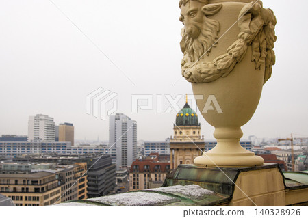 Berlin skyline with historical New German Catherdral and modern buildigs. Panoramic view of foggy Berlin from the rooftop of French Church on a misty day. Copy space Berlin skyline with historical New German Catherdral and modern buildigs. Panoramic view of foggy Berlin from the rooftop of French Church on a misty day. Copy space 140328926