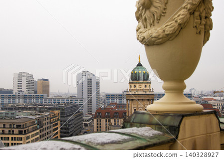 Berlin skyline with historical New German Catherdral and modern buildigs. Panoramic view of foggy Berlin from the rooftop of French Church on a misty day. Copy space Berlin skyline with historical New German Catherdral and modern buildigs. Panoramic view of foggy Berlin from the rooftop of French Church on a misty day. Copy space 140328927