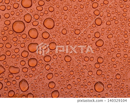 Countless water droplets spread across an orange surface / Fresh and beautiful background texture material Countless water droplets spread across an orange surface / Fresh and beautiful background texture material 140329104