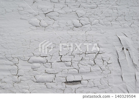 White wall with cracked paint White wall with cracked paint 140329504