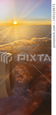 A view of the bright setting sun and an aircraft turbine A view of the bright setting sun and an aircraft turbine 140329673