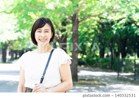 middle-aged women commuting to work middle-aged women commuting to work 140332531