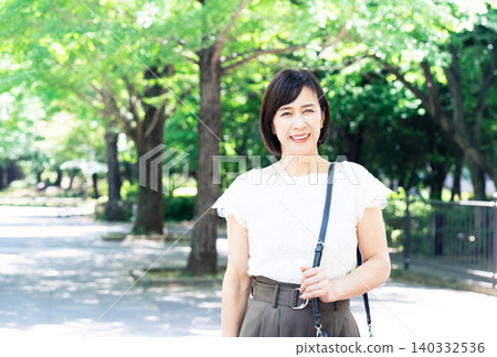 middle-aged women commuting to work 140332536