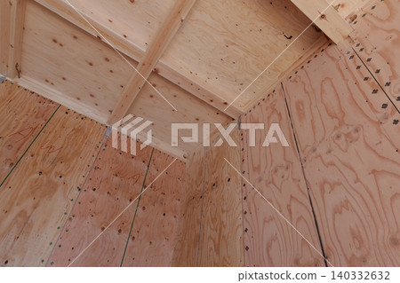 Timber Framing Structure of Residential Building at Construction Site, Low Angle View Timber Framing Structure of Residential Building at Construction Site, Low Angle View 140332632