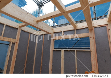 Timber Framing Structure of Residential Building at Construction Site, Low Angle View Timber Framing Structure of Residential Building at Construction Site, Low Angle View 140332641
