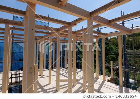 Timber Framing Structure of Residential Building at Construction Site, Low Angle View Timber Framing Structure of Residential Building at Construction Site, Low Angle View 140332654