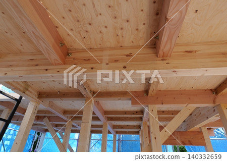 Timber Framing Structure of Residential Building at Construction Site, Low Angle View Timber Framing Structure of Residential Building at Construction Site, Low Angle View 140332659