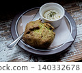 Scones and cream placed on a wooden table 140332678