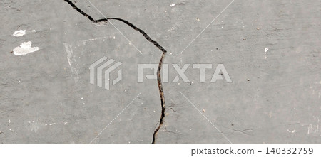 Cracked grey concrete wall texture with structural damage and weathered surface 140332759