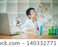 Asian male science students looking through a microscope and tests of plants in the classroom. Learning about scientific experiments on plant species. 140332771