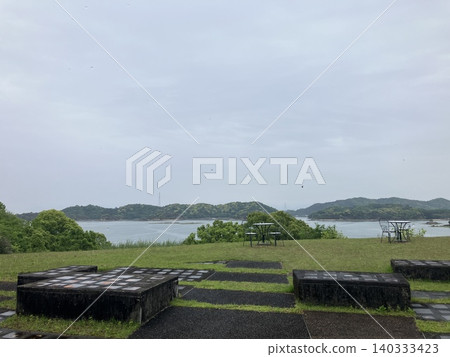 A calm sea and cloudy landscape of islands A calm sea and cloudy landscape of islands 140333423