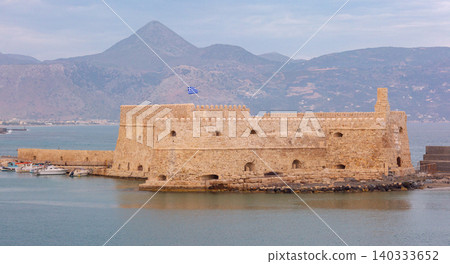Venetian Fortress at Heraklion Harbor with Mountains on Crete Greece Venetian Fortress at Heraklion Harbor with Mountains on Crete Greece 140333652