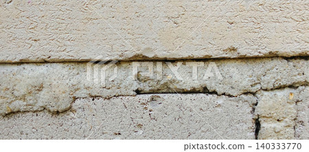 Weathered brick wall texture with cracked mortar and old brick layers 140333770