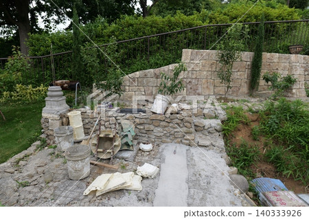 Residential House Construction Site with Structural Framework and Scaffolding and mixer Residential House Construction Site with Structural Framework and Scaffolding and mixer 140333926