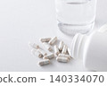 A glass of water and supplements 140334070