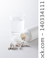 A glass of water and supplements 140334111