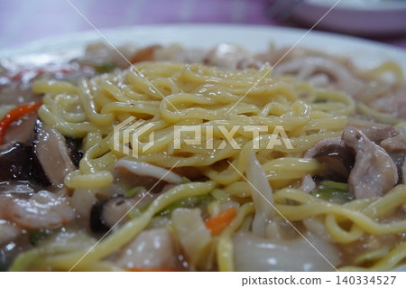 Korean unique stir fried noodles with thick savory sauce and shrimps Korean unique stir fried noodles with thick savory sauce and shrimps 140334527