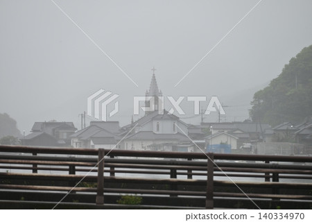 Sakitsu Church shrouded in rain mist 140334970