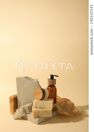 Skin care items arranged with grey stone and soft fabric Skin care items arranged with grey stone and soft fabric 140335541
