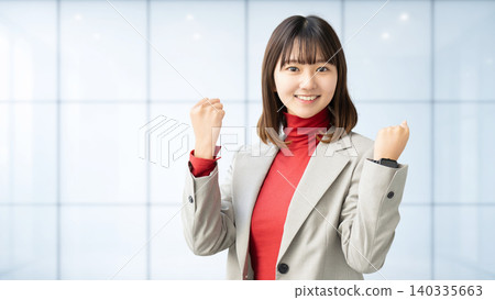 Woman/businesswoman doing a fist pump Woman/businesswoman doing a fist pump 140335663