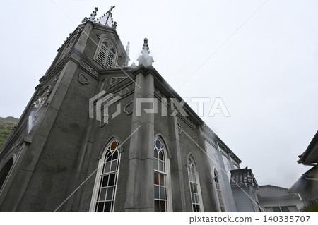 Sakitsu Church stands tall in a quiet village in Amakusa. 140335707