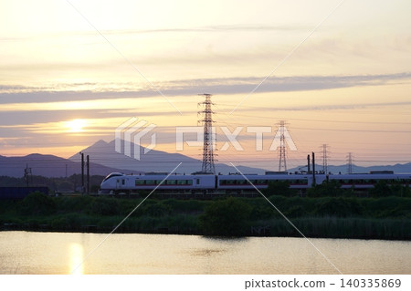 Mount Tsukuba and an express train at sunset 140335869