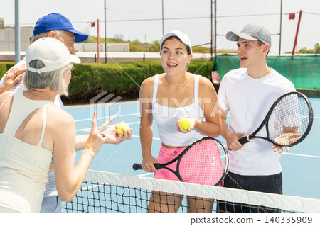 Portrait of smiling tennis team. Portrait of smiling tennis team. 140335909