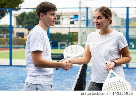 Paddle tennis players shaking hands after match 140335939