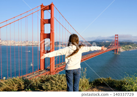 Woman overlooking Golden Gate Bridge from Marin Headlands viewpoint Woman overlooking Golden Gate Bridge from Marin Headlands viewpoint 140337729