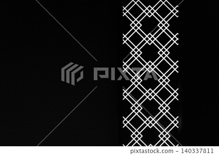 Graphic design background material featuring a white geometric diamond grid pattern on a black background. Copy space available. Graphic design background material featuring a white geometric diamond grid pattern on a black background. Copy space available. 140337811