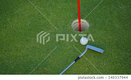 Golf balls on a green lawn in a beautiful golf course with morning sunshine. Golf balls on a green lawn in a beautiful golf course with morning sunshine. 140337944